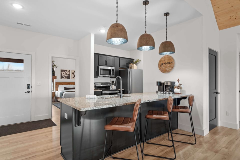 
Have a conversation with the cook while sitting at the kitchen counter chairs.