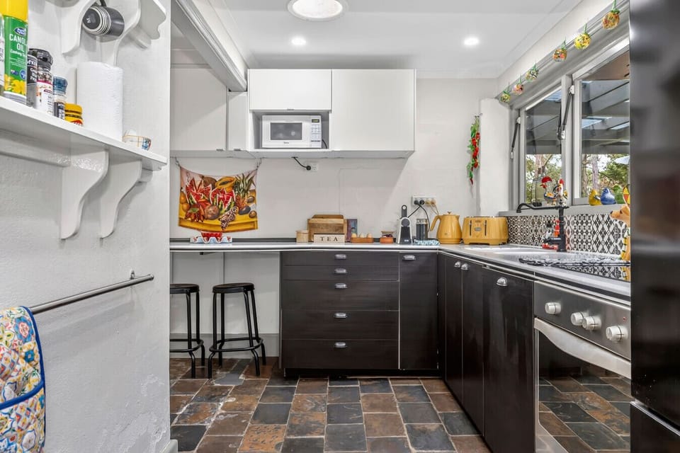 Fully equipped kitchen with modern appliances and plenty of bench space.