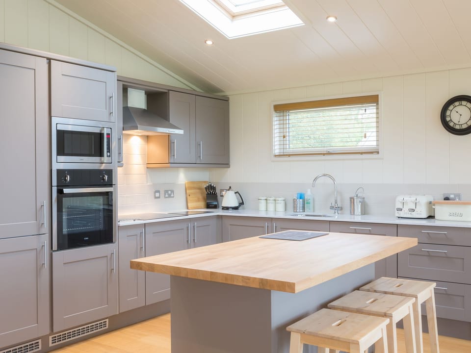 Lovely kitchen area with breakfast bar | Cedar Lodge - South Downs Lodges, Hassocks