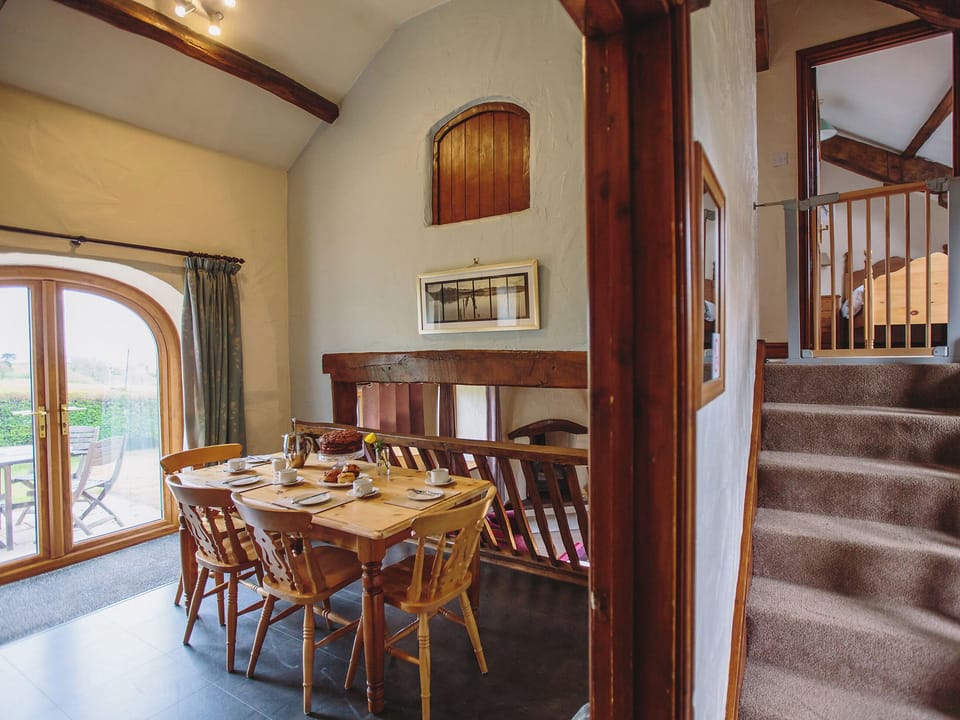 Light and airy dining area and stairs to bedrooms | Low Barn, Castle Carrock, near Brampton