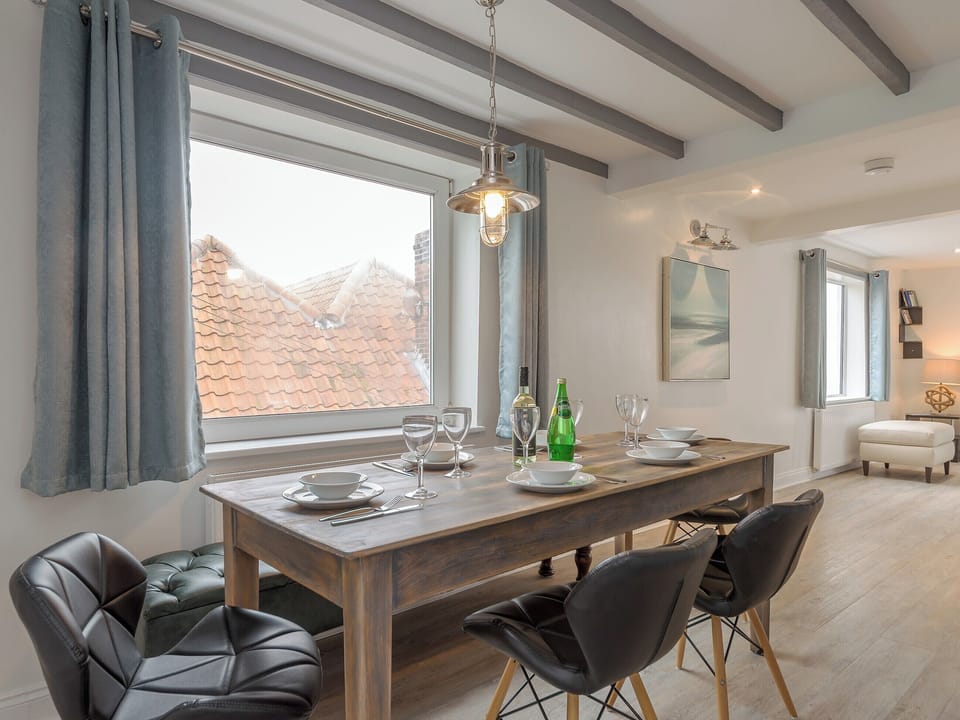 Dining area with beamed ceiling | The Ropery - Cyana Cottages, Whitby