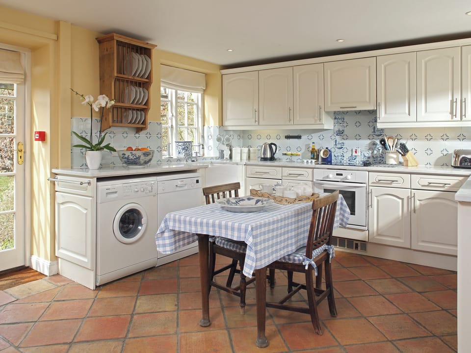 Well-appointed fitted kitchen with dining area | Saratoga - Bruern Holiday Cottages, Bruern, near Chipping Norton