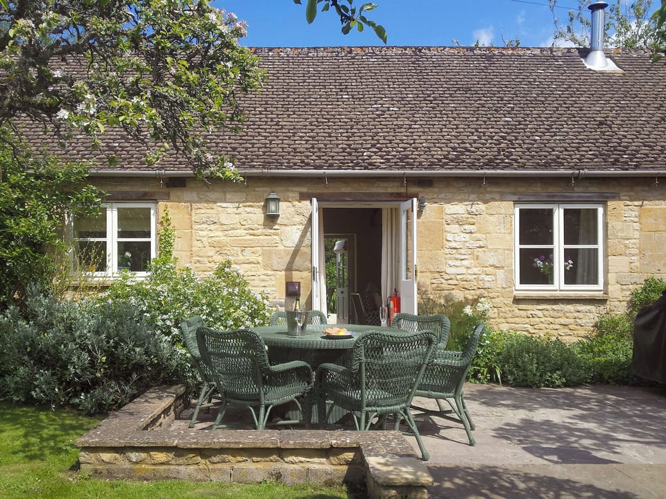 Patio and rear entrance | Shipton - Bruern Holiday Cottages, Bruern, near Chipping Norton