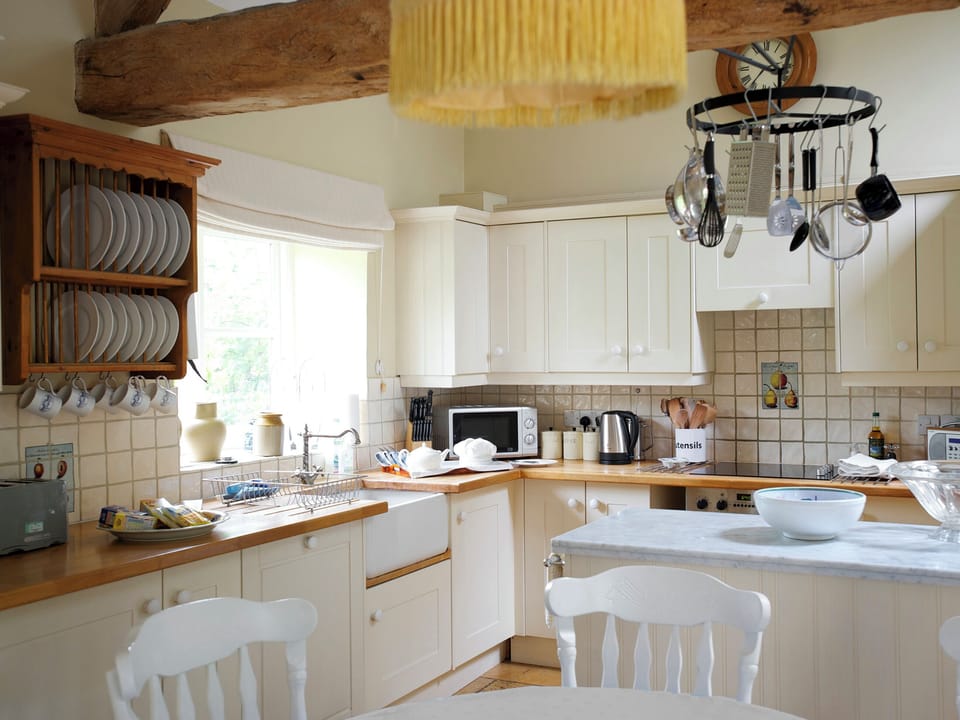 Well-equipped kitchen with &lsquo;island&rsquo; feature | Shipton - Bruern Holiday Cottages, Bruern, near Chipping Norton