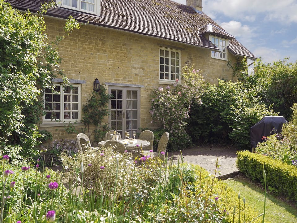 Rear garden with patio area | Aintree - Bruern Holiday Cottages, Bruern, near Chipping Norton