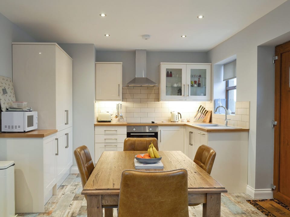 Well-equipped fitted kitchen with dining area | The Corn Store - Millmoor Farm, Bickley, near Malpas