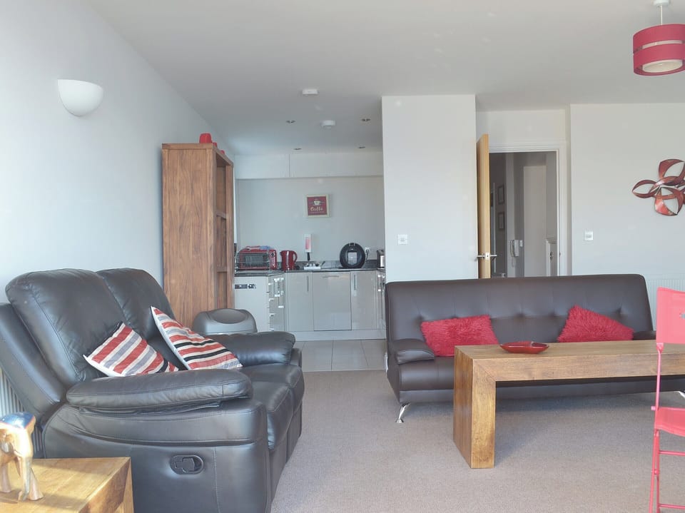 A tiled floor and white painted walls give an airy, Mediterranean feel to the apartment | Apartment 6 - Astor House, Torquay