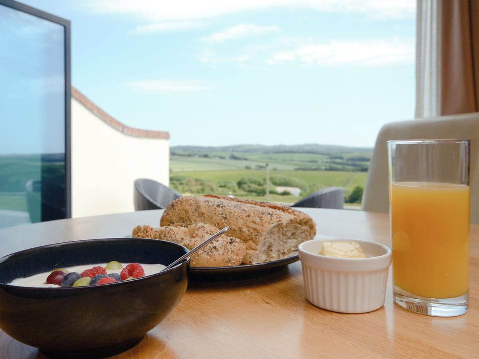 Dining area with brillinat views out to the countryside | Milky Way - Wooldown Holiday Cottages, Marhamchurch, near Bude