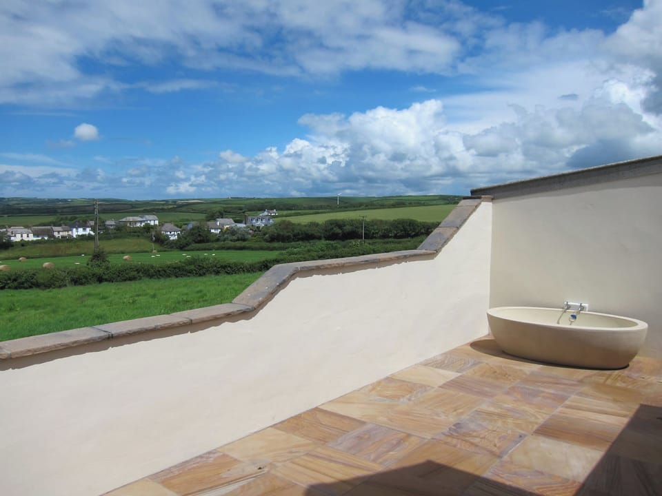 Delightful patio with wonderful views | Dreamcatcher - Wooldown Holiday Cottages, Marhamchurch, near Bude