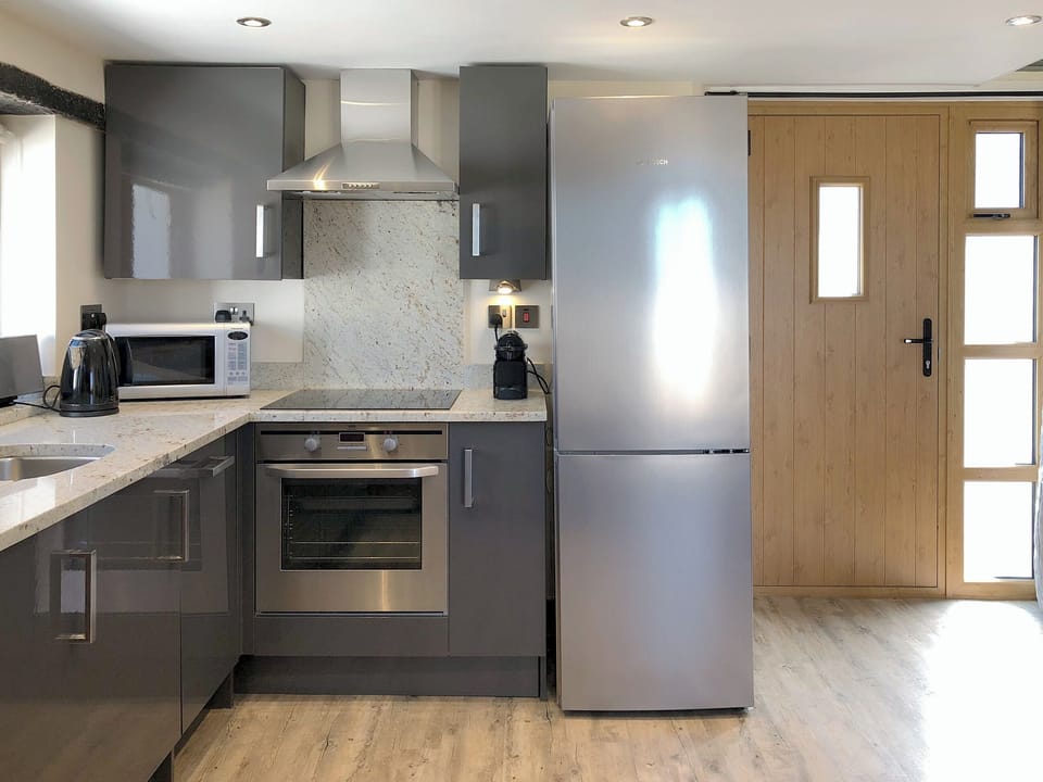 Well equipped kitchen area | Dreamcatcher - Wooldown Holiday Cottages, Marhamchurch, near Bude