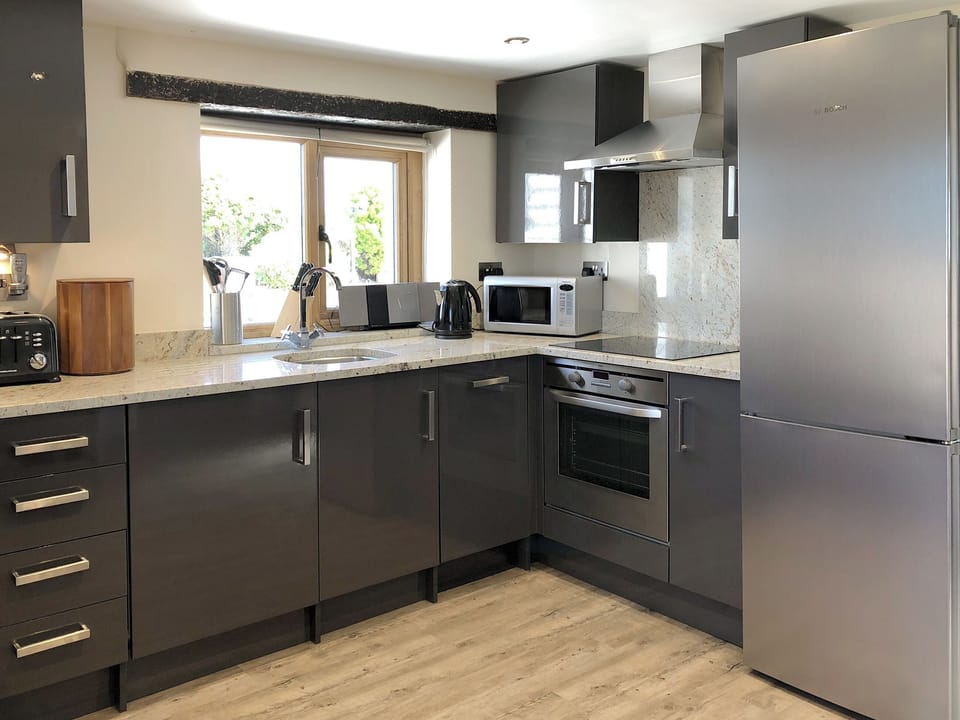 Well equipped kitchen area | Dreamcatcher - Wooldown Holiday Cottages, Marhamchurch, near Bude