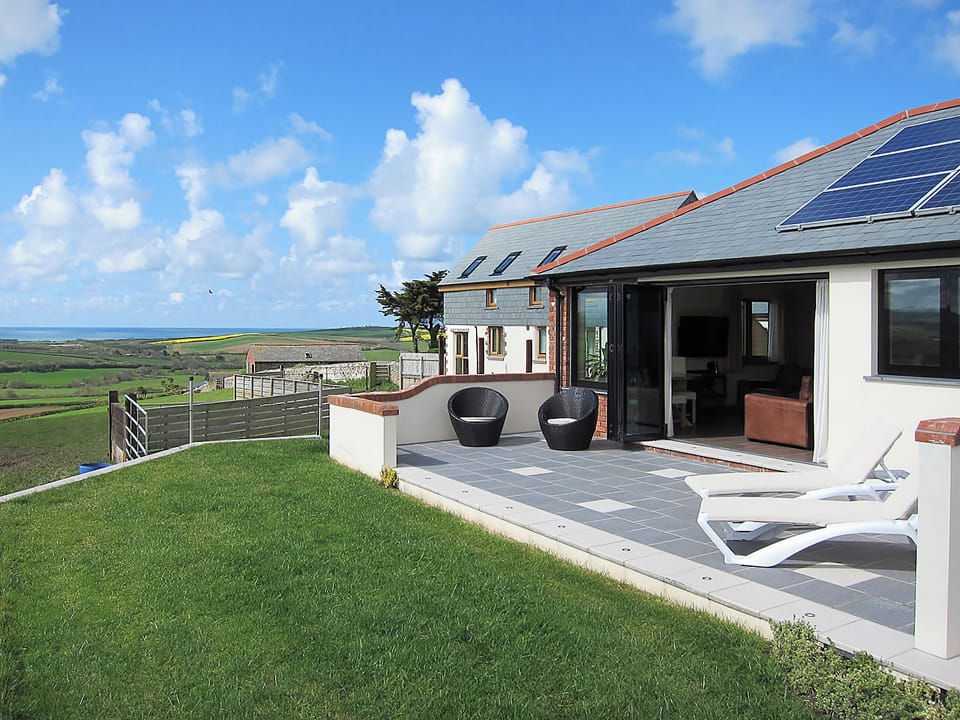 Delightful patio area | Shooting Star - Wooldown Holiday Cottages, Marhamchurch, near Bude