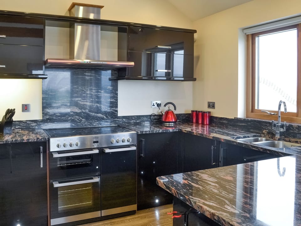 Well-equipped kitchen area | Shooting Star - Wooldown Holiday Cottages, Marhamchurch, near Bude