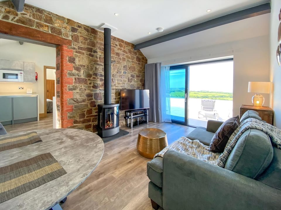 Living room/dining room | Woolbarn - Wooldown Holiday Cottages, Marhamchurch, near Bude
