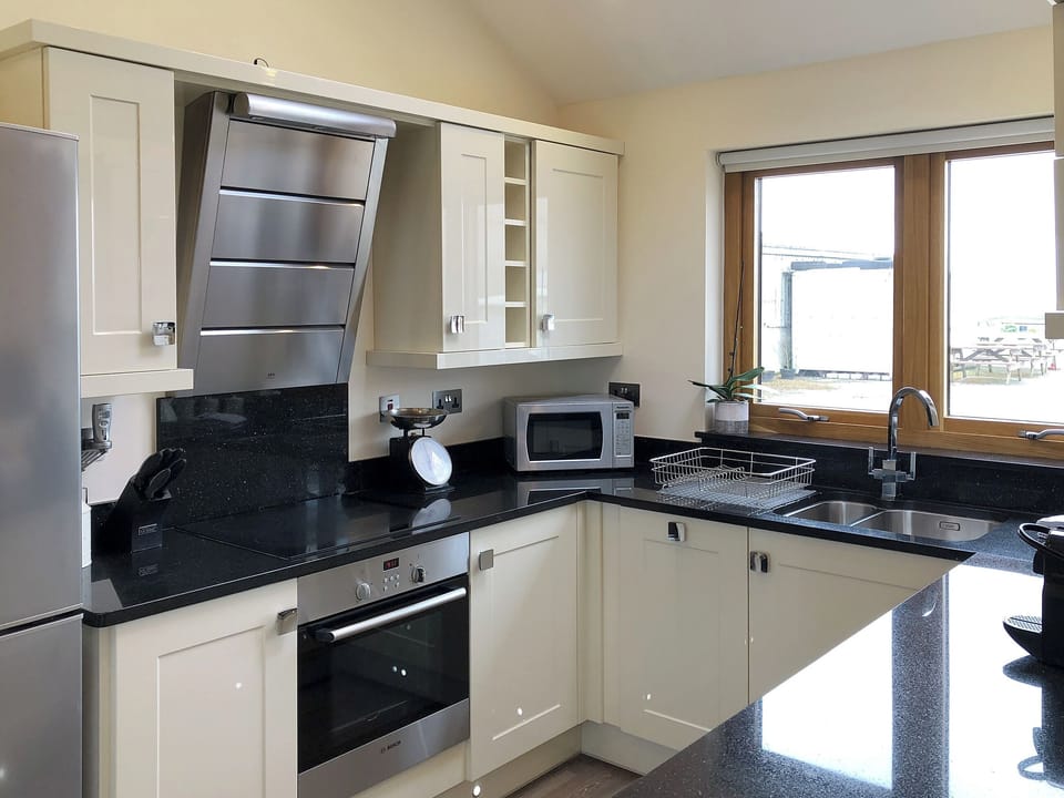 Well equipped kitchen area | Stargazey - Wooldown Holiday Cottages, Marhamchurch, near Bude