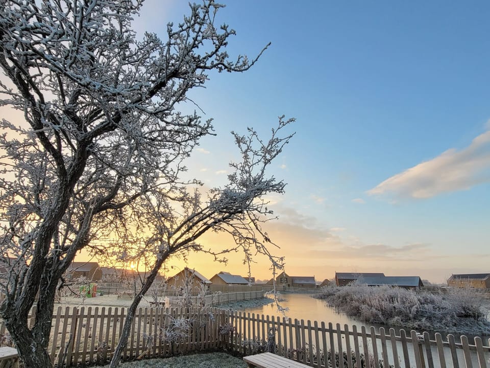 View from across lake in winter | Rowan House - Ashlin Farm Barns, Dunholme, near Lincoln