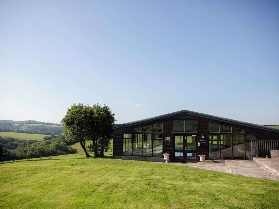Swimming pool | Honeysuckle Cottage - Woodlands Manor Farm, Woodford, near Bude