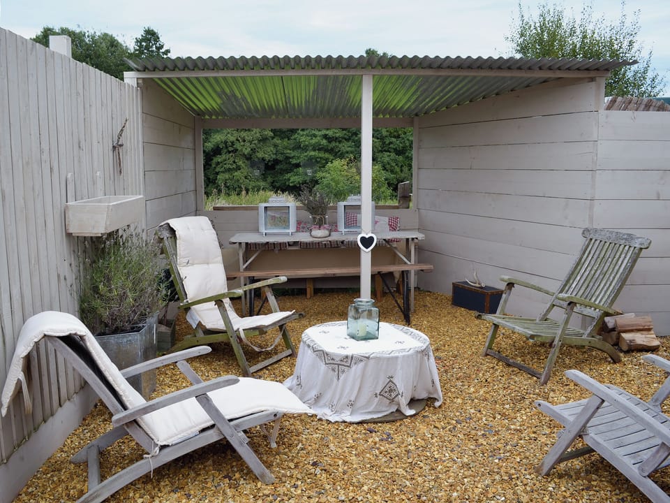 Courtyard with garden furniture, BBQ and chiminea | The Old Parlour - Cheshire Boutique Barns, Wrenbury, near Nantwich