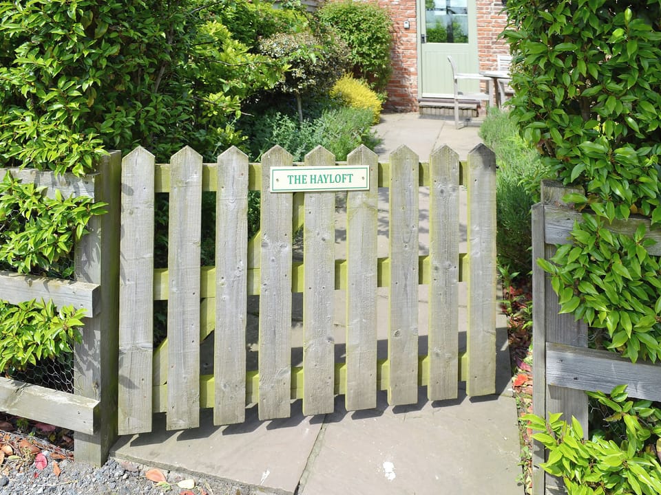 Charming gated garden entrance | The Hayloft - Mackinder Farms, Brayton, Selby