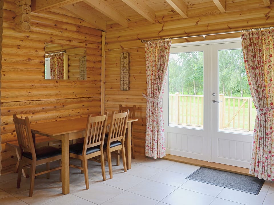 There is a great dining area close to the double doors to the terrace | Quail Lodge - Mackinder Farms, Brayton, Selby