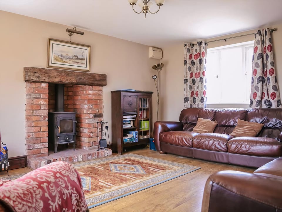 Spacious living room with wood burning stove | Miller&rsquo;s House - Millmoor Farm, Bickley, near Malpas