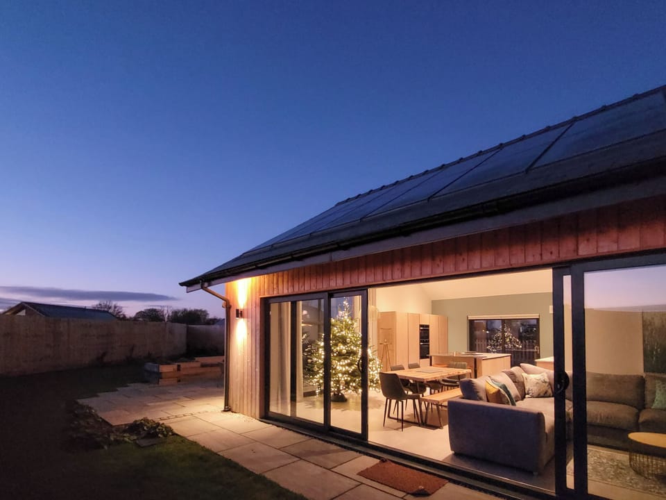 Bifold doors, living area and kitchen | Marsh Marigold Cottage - Ashlin Farm Barns, Dunholme, near Lincoln