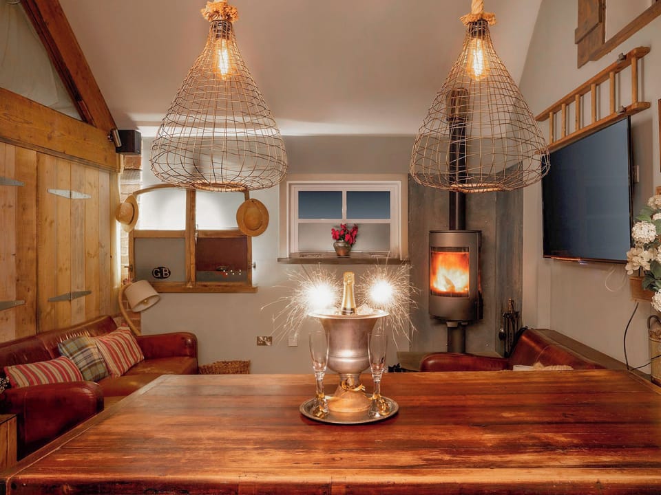 Cosy sitting room | The Cowshed - Cheshire Boutique Barns, Wrenbury, near Nantwich