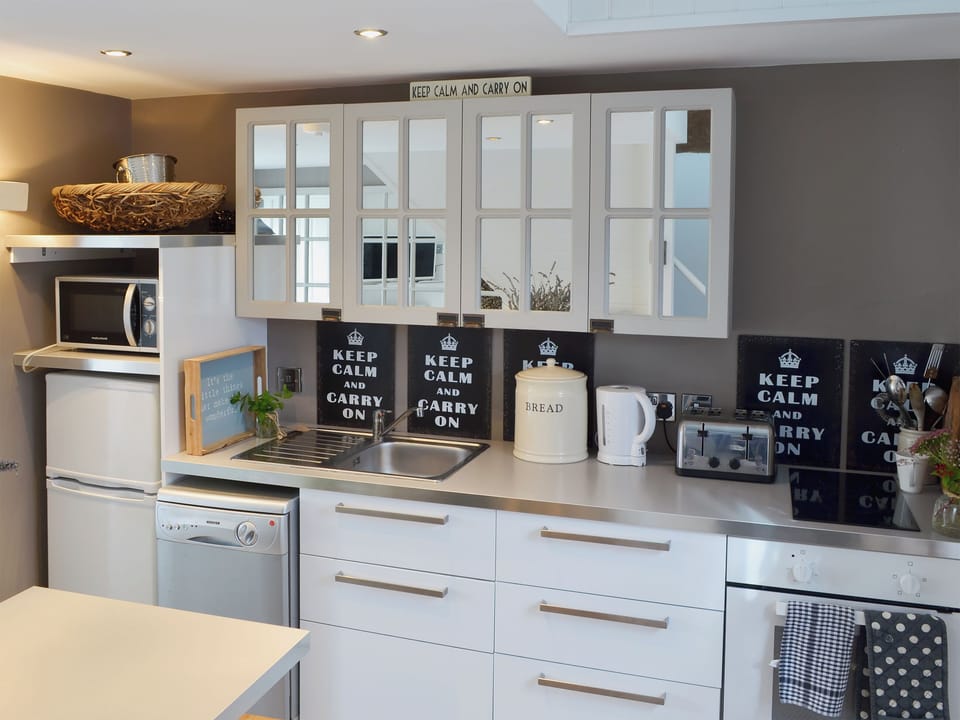 Kitchen with breakfast bar | The Nest - Cheshire Boutique Barns, Wrenbury, near Nantwich