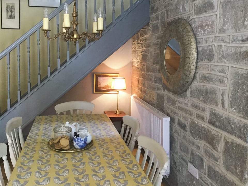 Exposed stone feature wall in dining area | Bramble, Over Haddon, near Bakewell