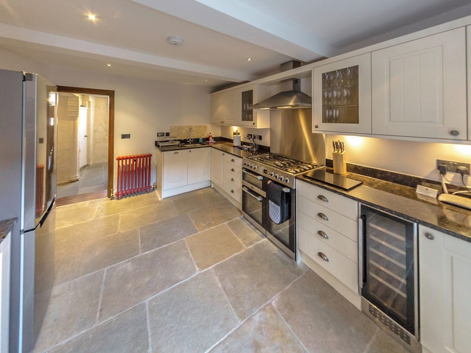 Modern well-equipped fitted kitchen with stone slab floor | Lendal Tower, York