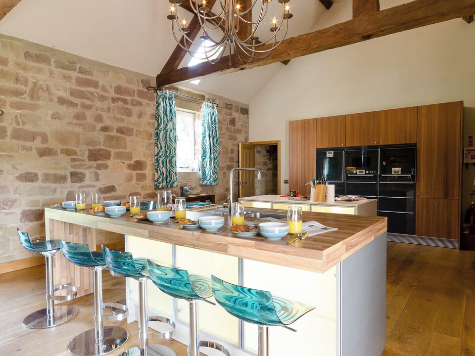 Open plan living space with breakfast bar | Woodpecker Loft - Millfields Farm, near Carsington