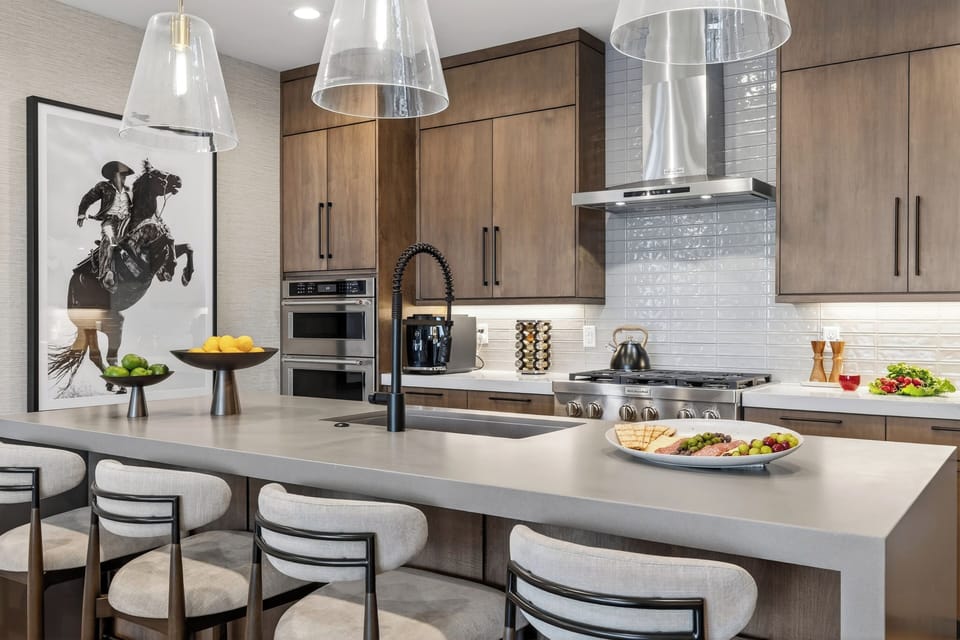 Chef-style kitchen with a spacious island, 4 counter seats, and premium stainless steel appliances—perfect for après-ski bites and big breakfasts.