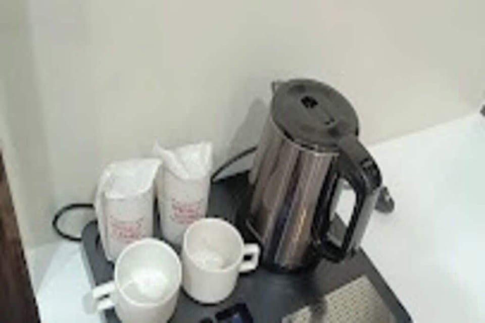 Deluxe Double Room, City View | In-room dining