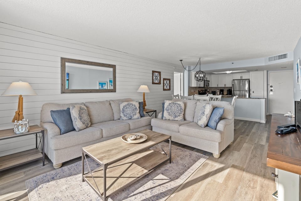 Large Living Room with plenty of seating, balcony access and large screen TV