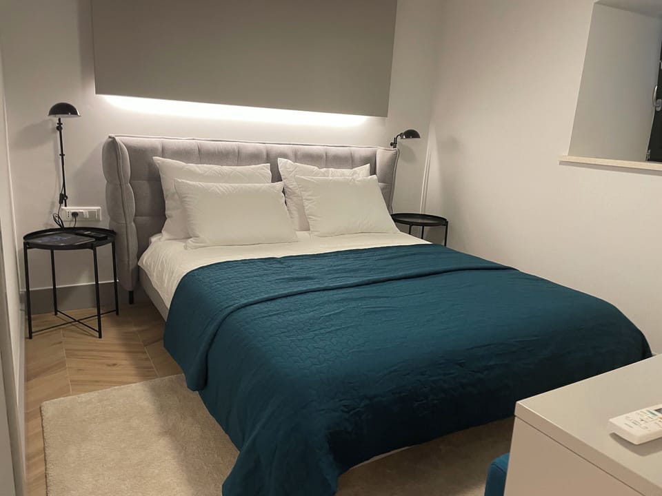 Apartment | In-room safe, individually decorated, iron/ironing board, travel crib