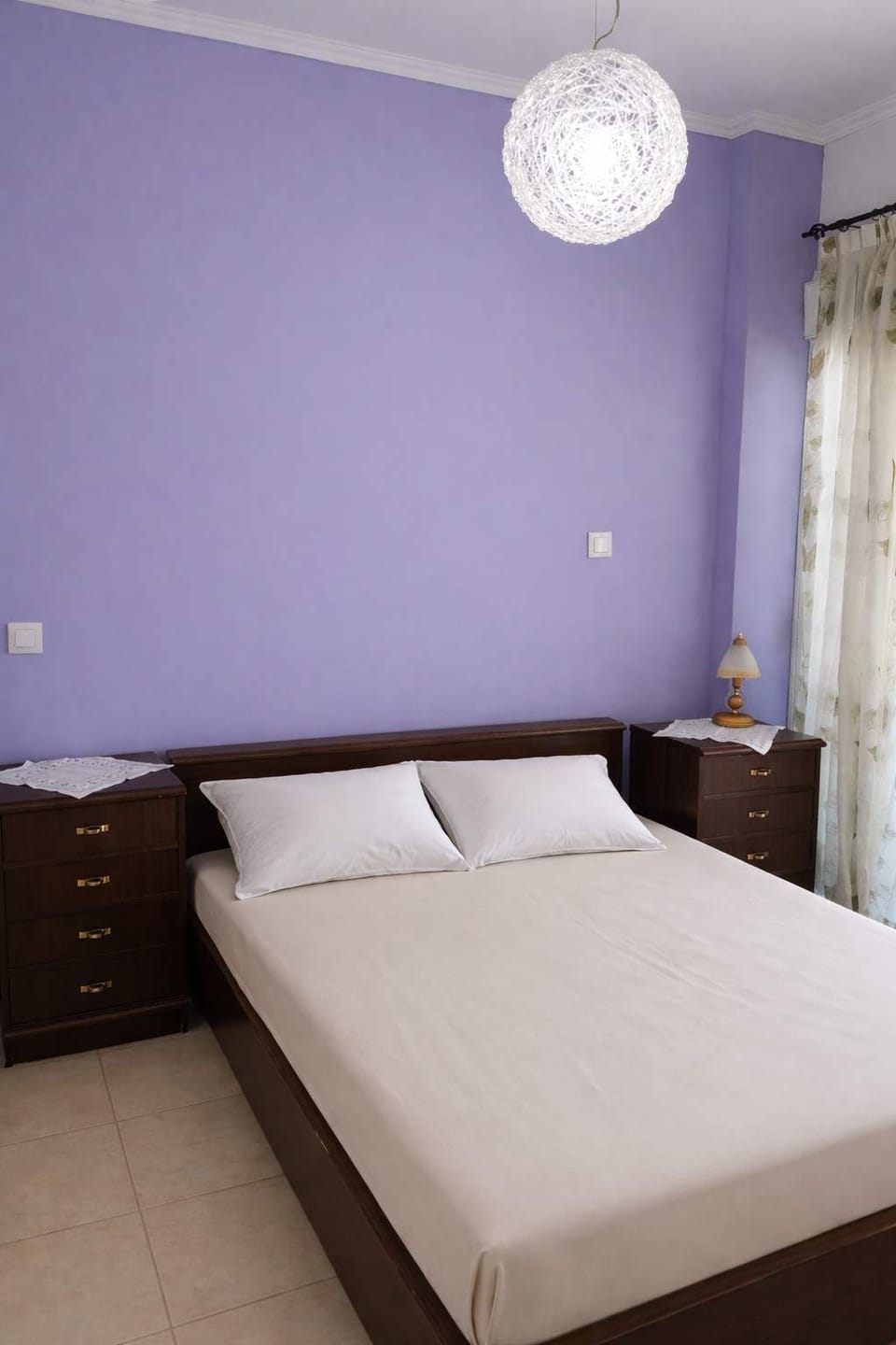 Inviting bedroom with warm lighting and soft tones, creating a relaxing atmosphere for a great night’s sleep.