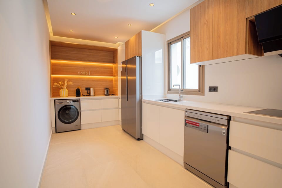 Pearl Kitchen with sink, LG dishwasher, LG stove top with vent