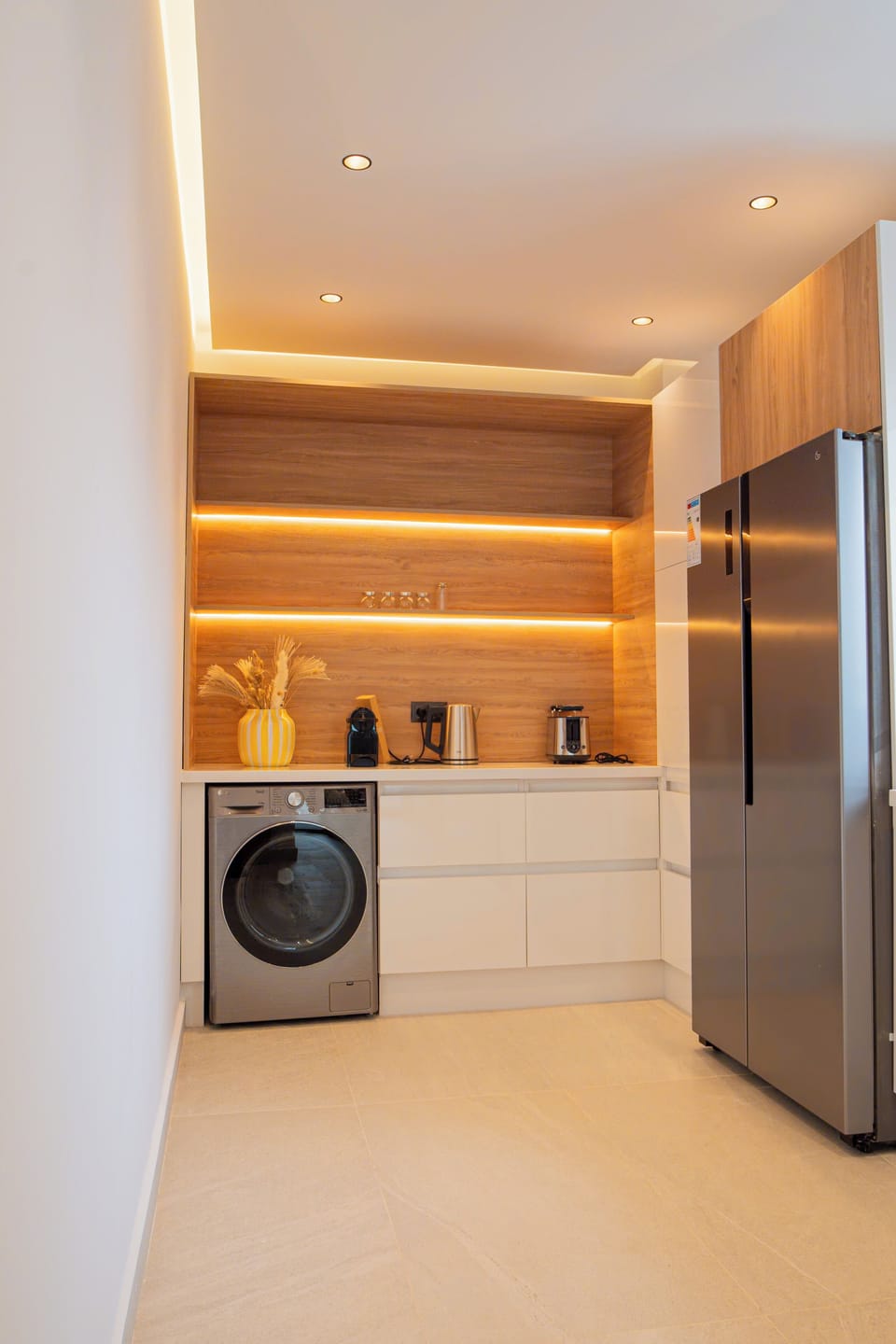 Pearl Kitchen with LG Refrigerator (Side-by-Side 423L capacity), LG washer (8KG - 68L capacity), water kettle, coffee espresso machine, and toaster 