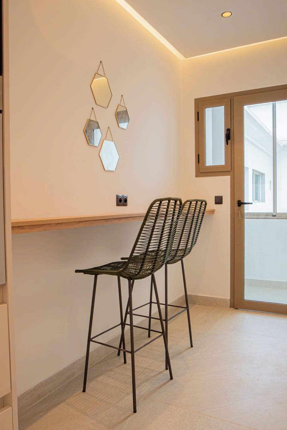 Pearl Kitchen with breakfast bar and two stool chairs