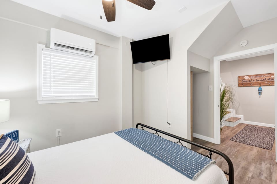 Bedroom 6 is located on the ground level, bathroom access is on levels 2 and 3