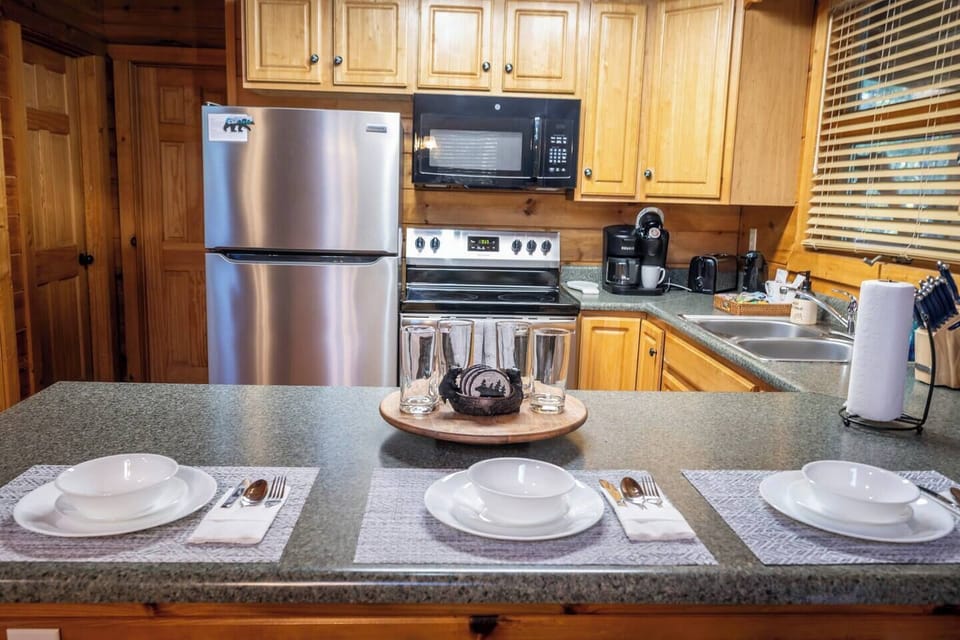 Your fully equipped kitchen invites culinary adventures with stainless steel appliances, granite counters, and everything needed for memorable meals together.