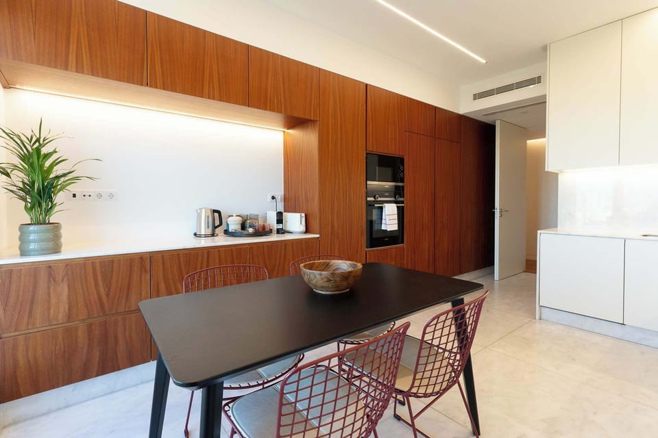 ❤️StayInLisbon – Kitchen offering a streamlined workspace for effortless cooking