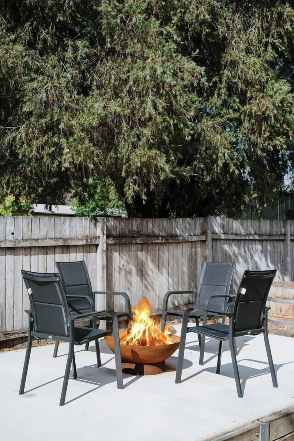 As the sun sets, gather around the fire pit in the private backyard and unwind beneath a starlit sky.