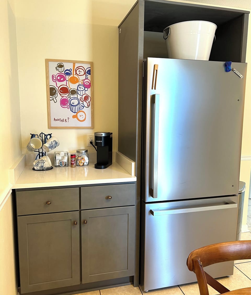 Your well-equipped kitchen nook features everything you need: full-size stainless steel fridge, coffee station with Keurig, and ample storage for all your vacation treats.