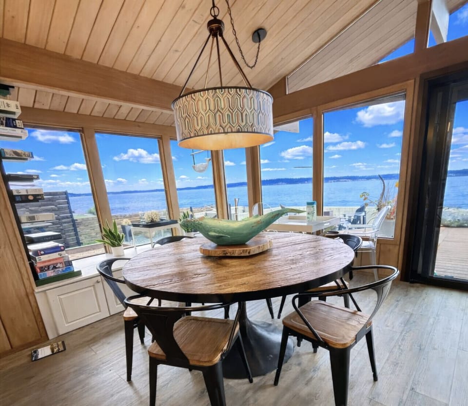 Dining Room: Stunning waterfront views enhance every meal in this stylish space!