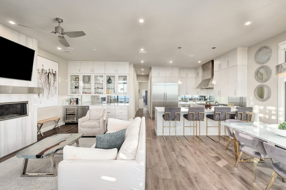 Your spacious open-concept haven features a gourmet kitchen with island seating, cozy living room with fireplace, and seamless flow perfect for entertaining.