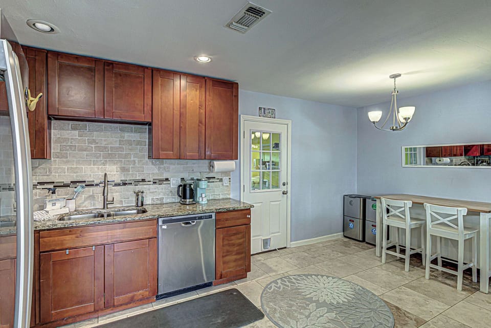 Modern kitchen with stainless steel appliances.