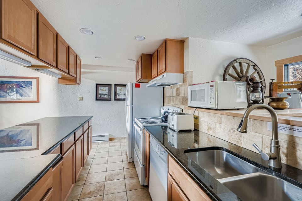 Your fully equipped kitchen features granite counters, modern appliances, and thoughtful Western touches for memorable meal preparation.