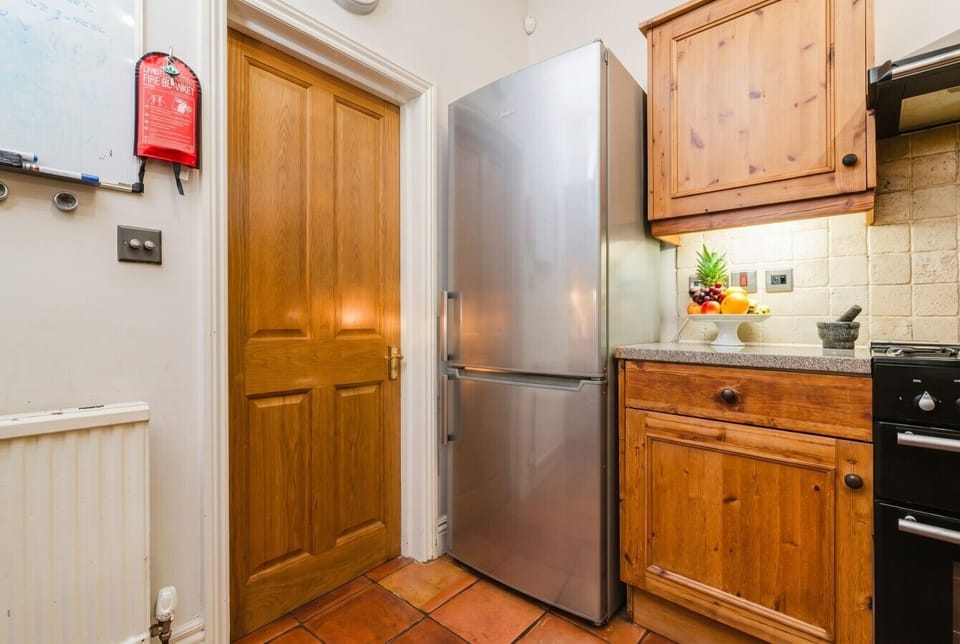 Full-size fridge freezer keeps the whole group well stocked