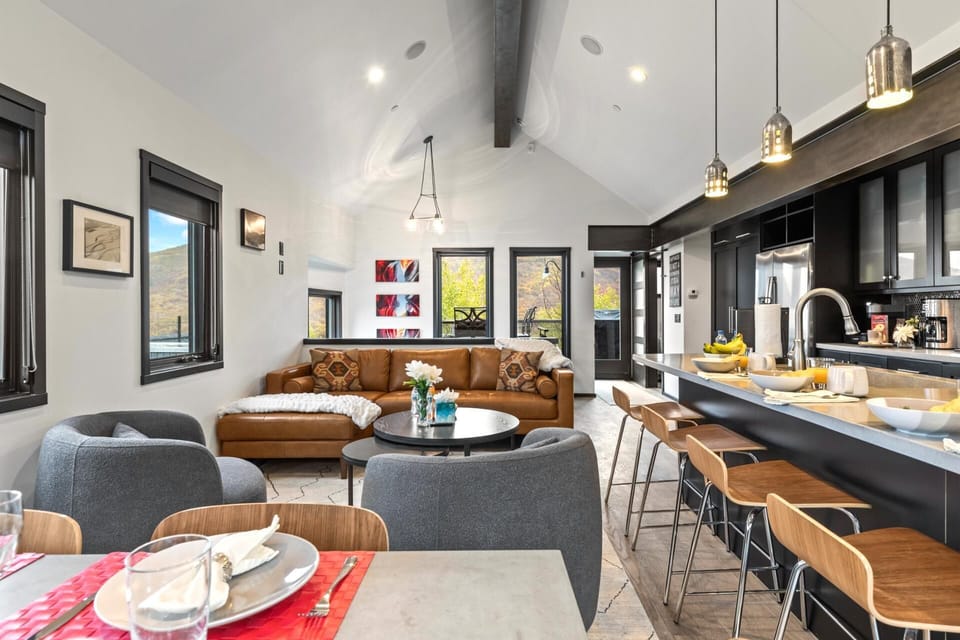 Open-concept living area with vaulted ceilings and stylish furnishings brings everyone together in one bright space.